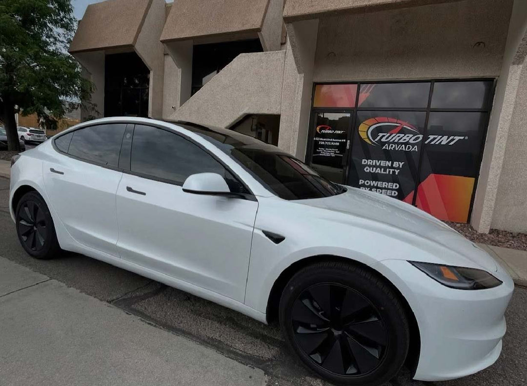 white tesla infront of turbo tint arvada with a tinted panoramic sunroof